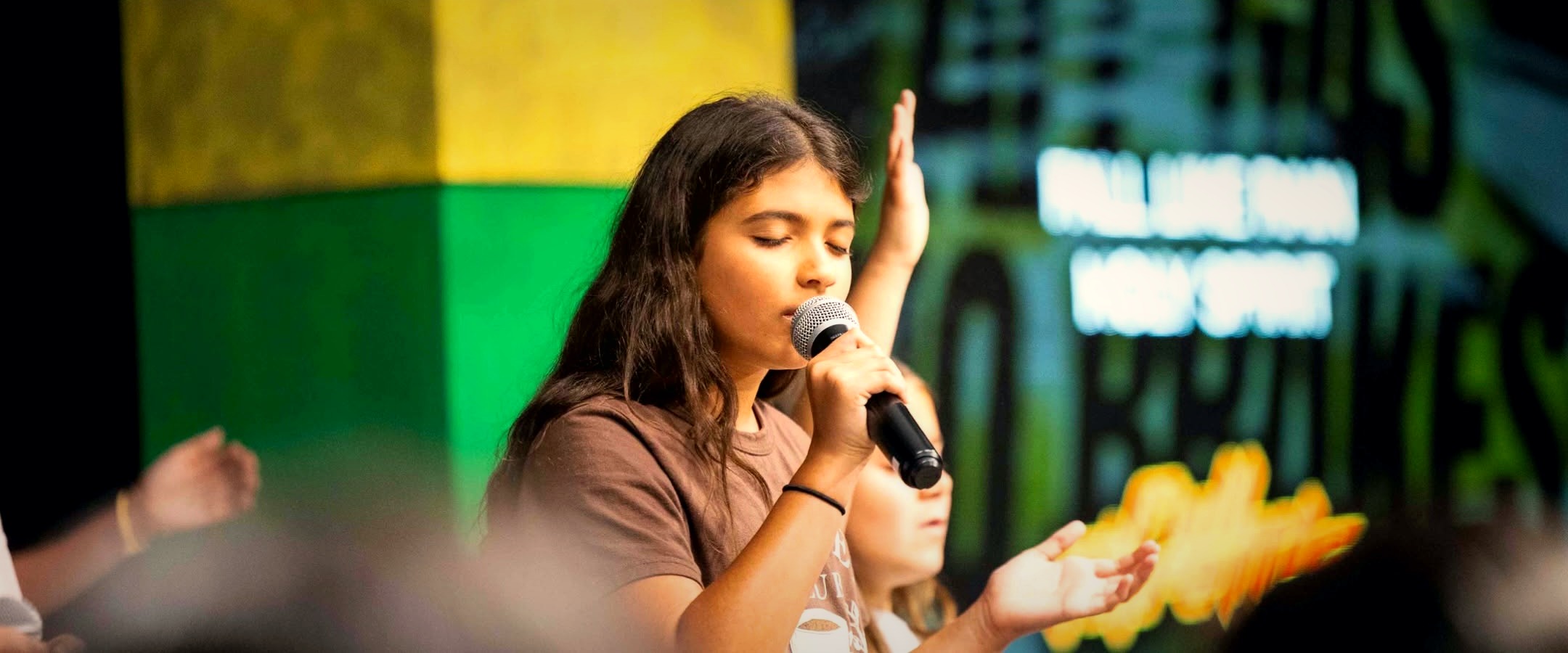 Kids leading worship at Kids Conference